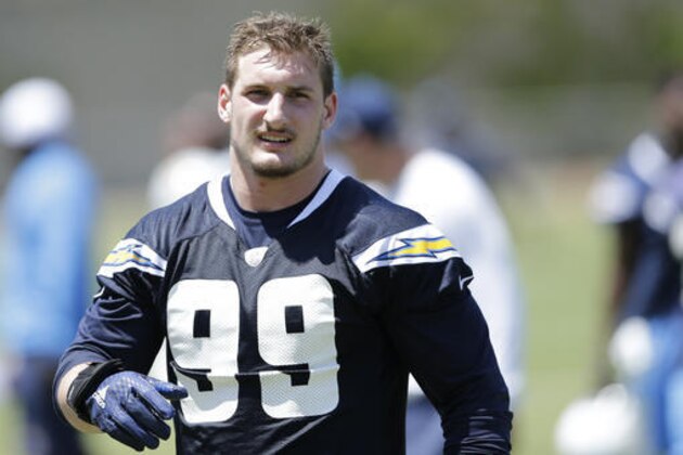 FILE - In this May 13, 2016, file photo, San Diego Chargers rookie defensive end Joey Bosa trains during an NFL football rookie training camp in San Diego. The Chargers have withdrawn their contract offer to first-round draft pick Joey Bosa and will restructure a new deal that takes into account his absence from the team. The Chargers' statement Wednesday, Aug. 24, 2016, said they believe