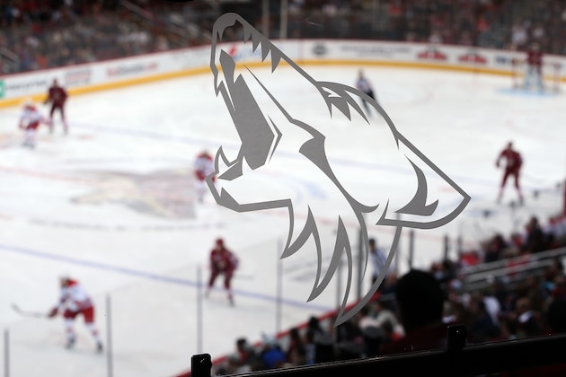 GLENDALE, AZ - DECEMBER 14:  A Coyote's logo is depicted on a glass railing during the NHL game between the Phoenix Coyotes and the Carolina Hurricanes at Jobing.com Arena on December 14, 2013 in Glendale, Arizona. The Hurricanes defeated the Coyotes 3-1.  (Photo by Christian Petersen/Getty Images)