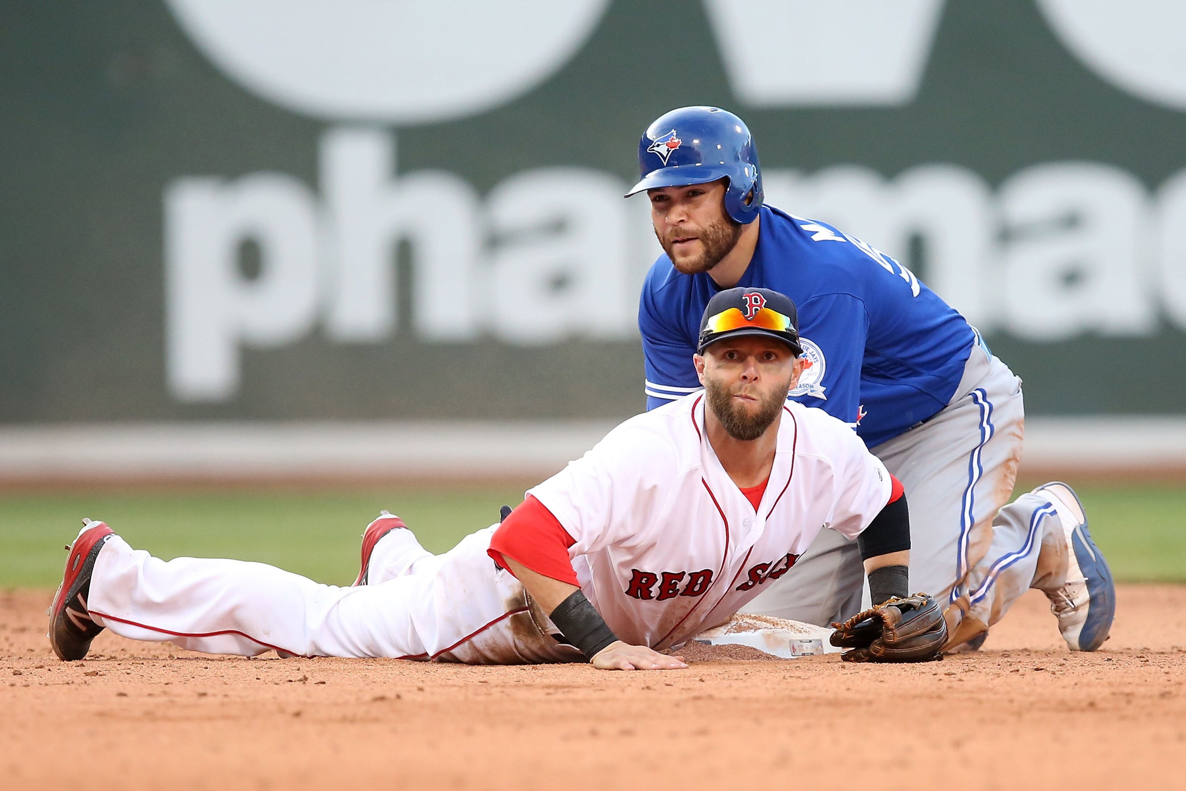 BOSTON, MA - JUNE 04:  Dustin Pedroia #15 of the Boston Red Sox looks on after turning a double play as Russell Martin #55 of the Toronto Blue jays looks on in the eighth inning during the game at Fenway Park on June 4, 2016 in Boston, Massachusetts.  (Photo by Adam Glanzman/Getty Images)