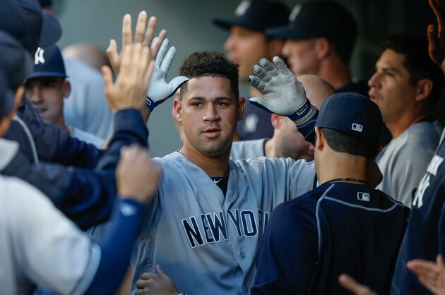 SEATTLE, WA - AUGUST 22:  Gary Sanchez #24 of the New York Yankees is congratulated by teammates after hitting a home run against the Seattle Mariners in the first inning at Safeco Field on August 22, 2016 in Seattle, Washington.  (Photo by Otto Greule Jr/Getty Images)