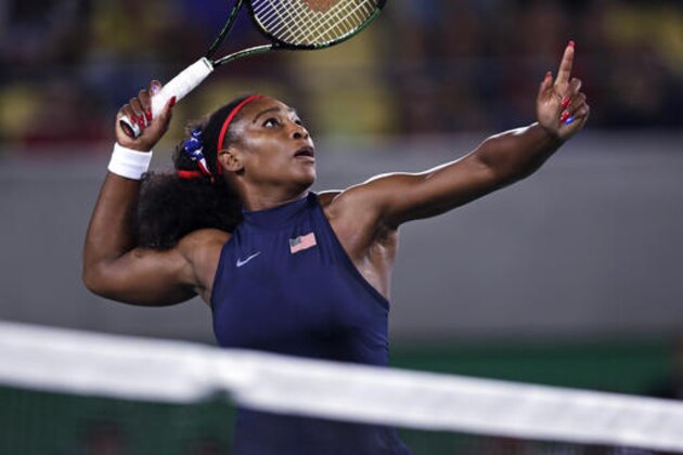 Serena Williams, of the United States, lines up a return at the net against Elina Svitolina, of Urkraine, at the 2016 Summer Olympics in Rio de Janeiro, Brazil, Tuesday, Aug. 9, 2016. (AP Photo/Charles Krupa)