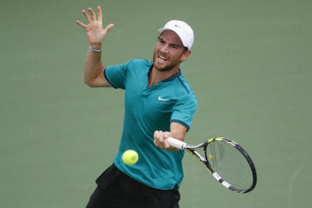 Adrian Mannarino, of France, returns the ball to Richard Gasquet, of France, on the fourth day of the Western & Southern Open tennis tournament, Tuesday, Aug. 16, 2016, in Mason, Ohio. (AP Photo/John Minchillo)