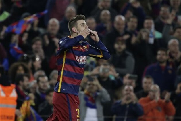 Barcelona's Gerard Pique celebrates scoring his side's first goal during a Spanish La Liga soccer match between Barcelona and Real Madrid, dubbed 'el clasico', at the Camp Nou stadium in Barcelona, Spain, Saturday, April 2, 2016. (AP Photo/Emilio Morenatti)