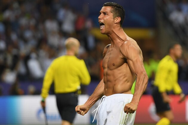 MILAN, ITALY - MAY 28:  Cristiano Ronaldo of Real Madrid celebrates scoring the winning penalty during the UEFA Champions League Final match between Real Madrid and Club Atletico de Madrid at Stadio Giuseppe Meazza on May 28, 2016 in Milan, Italy.  (Photo by Laurence Griffiths/Getty Images)