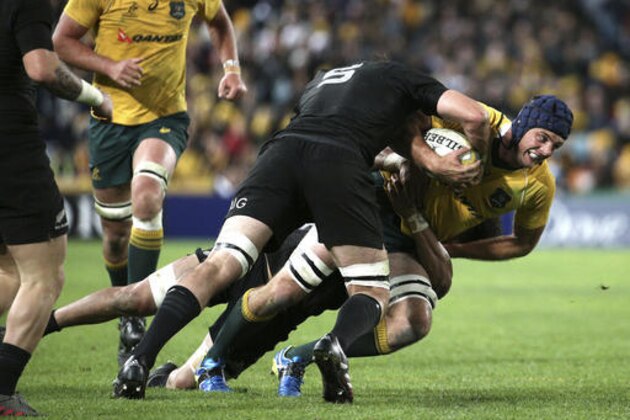 Australia's Dean Mumm, right, is tackled by New Zealand's Sam Whitelock during their Bledisloe Cup Rugby test match in Sydney, Australia, Saturday, Aug. 20, 2016.(AP Photo/Rob Griffith)