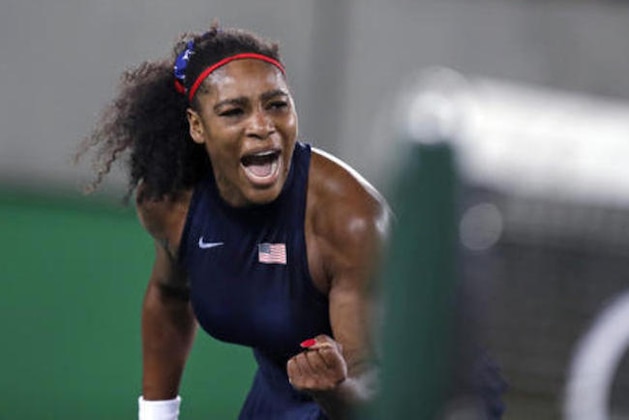 Serena Williams, of the United States, pumps her fist after winning a point at the net against Elina Svitolina, of Ukraine, at the 2016 Summer Olympics in Rio de Janeiro, Brazil, Tuesday, Aug. 9, 2016. (AP Photo/Charles Krupa)
