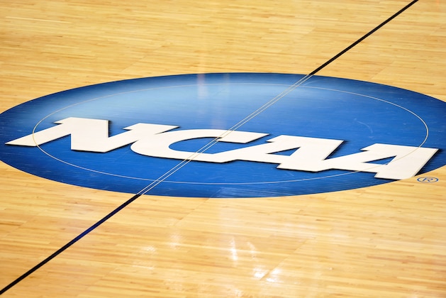 GREENSBORO, NC - MARCH 16: A view of the NCAA logo at center court during a game between the Vermont Catamounts and the North Carolina Tar Heels in the second round of the 2012 NCAA Men's Basketball Tournament at Greensboro Coliseum on March 16, 2012 in Greensboro, North Carolina. (Photo by Lance King/Getty Images) GREENSBORO, NC - MARCH 16: A view of the NCAA logo at center court during a game between the Vermont Catamounts and the North Carolina Tar Heels in the second round of the 2012 NCAA Men's Basketball Tournament at Greensboro Coliseum on March 16, 2012 in Greensboro, North Carolina. (Photo by Lance King/Getty Images)