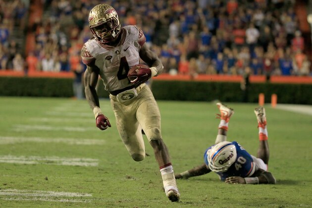 GAINESVILLE, FL - NOVEMBER 28:  Dalvin Cook #4 of the Florida State Seminoles runs for a touchdown during the game against the Florida Gators at Ben Hill Griffin Stadium on November 28, 2015 in Gainesville, Florida.  (Photo by Sam Greenwood/Getty Images)