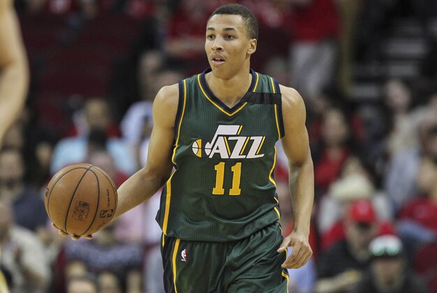Apr 15, 2015; Houston, TX, USA; Utah Jazz guard Dante Exum (11) brings the ball up the court during the first quarter against the Houston Rockets at Toyota Center. Mandatory Credit: Troy Taormina-USA TODAY Sports