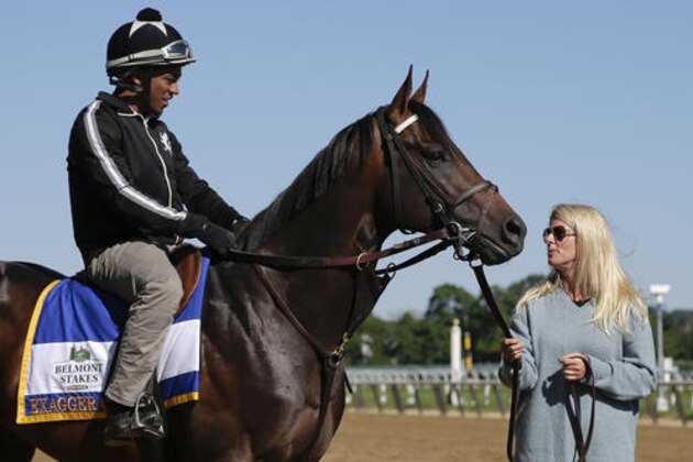 Assistant trainer Julie Clark, right, talks to exercise rider Jermal Landry before taking Belmont Stakes hopeful and Preakness Stakes winner, Exaggerator, out to gallop around the main track at Belmont Park, Friday, June 10, 2016, in Elmont, N.Y. Exaggerator will compete in the 148th running of the Belmont Stakes Horse Race on Saturday. (AP Photo/Julie Jacobson)