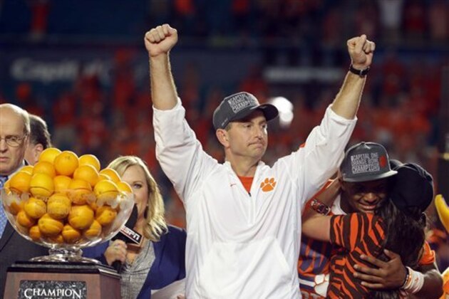 Clemson head coach Dabo Swinney raises his arms after winning the Orange Bowl NCAA college football semifinal playoff game against Oklahoma, Thursday, Dec. 31, 2015, in Miami Gardens, Fla. Clemson defeated Oklahoma 37-17 to advance to the championship game. (AP Photo/Lynne Sladky)