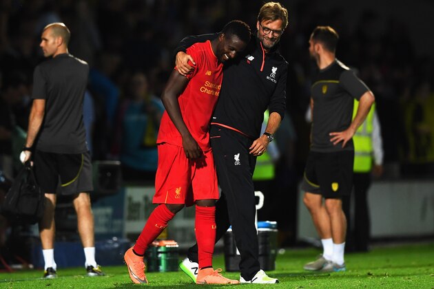 BURTON UPON TRENT, ENGLAND - AUGUST 23:  Jurgen Klopp, Manager of Liverpool celebrates with Divock Origi of Liverpool after the EFL Cup second round match between Burton Albion and Liverpool at Pirelli Stadium on August 23, 2016 in Burton upon Trent, England.  (Photo by Gareth Copley/Getty Images)