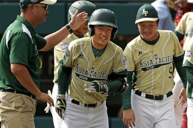 South Korea's Seum Kwon, center, celebrates as he returns to the dugout after hitting a two-run home run off Mexico's Victor Juarez during an International baseball game at the Little League World Series tournament in South Williamsport, Pa., Thursday, Aug. 25, 2016. (AP Photo/Gene J. Puskar)