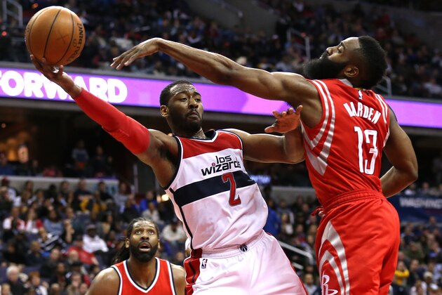 WASHINGTON, DC - MARCH 29: John Wall #2 of the Washington Wizards is defended by James Harden #13 of the Houston Rockets in the second half at Verizon Center on March 29, 2015 in Washington, DC. NOTE TO USER: User expressly acknowledges and agrees that, by downloading and or using this photograph, User is consenting to the terms and conditions of the Getty Images License Agreement. (Photo by Patrick Smith/Getty Images)