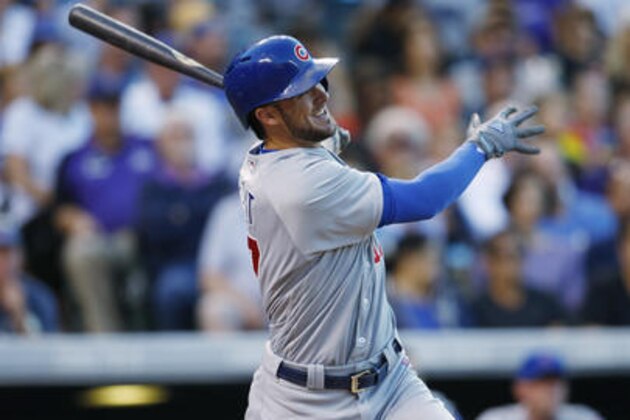 Chicago Cubs' Kris Bryant follows the flight of his three-run home run off Colorado Rockies starting pitcher Jeff Hoffman in the fifth inning of a baseball game Saturday, Aug. 20, 2016, in Denver. The Cubs won 9-2. (AP Photo/David Zalubowski)