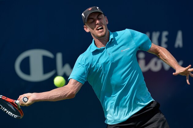 WINSTON SALEM, NC - AUGUST 25:  John Millman of Australia returns a shot to Richard Gasquet of France during the Winston-Salem Open at Wake Forest University on August 25, 2016 in Winston Salem, North Carolina.  (Photo by Grant Halverson/Getty Images)