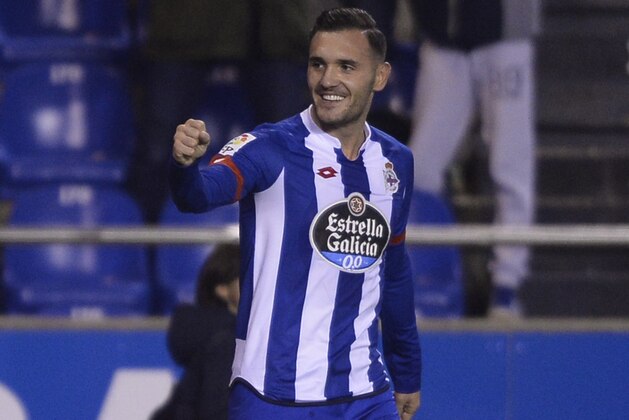 Deportivo La Coruna's midfielder Lucas Perez celebrates a goal during the Spanish league football match RC Deportivo de la Coruna vs Sevilla FC at the Municipal de Riazor stadium in La Coruna on December 5, 2015.   AFP PHOTO / MIGUEL RIOPA / AFP / MIGUEL RIOPA        (Photo credit should read MIGUEL RIOPA/AFP/Getty Images)