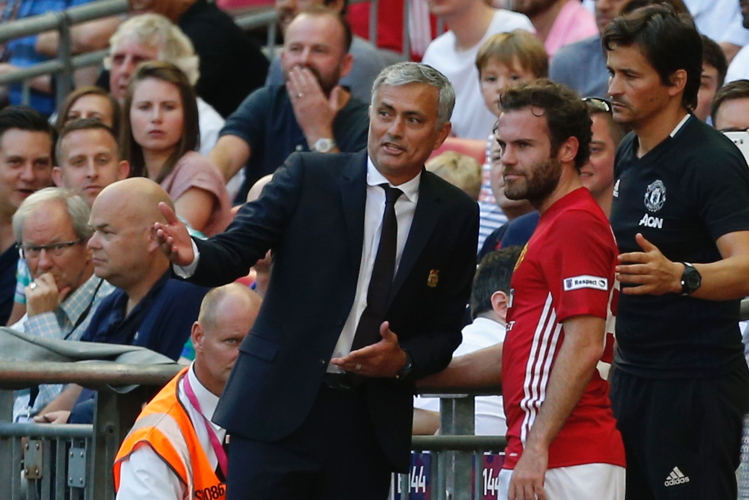 Manchester United's Spanish midfielder Juan Mata (C) talks with Manchester United's Portuguese manager Jose Mourinho (L) and  Manchester United's Portuguese assistant manager Rui Faria (R) after he is substituted late on during the FA Community Shield football match between Manchester United and Leicester City at Wembley Stadium in London on August 7, 2016.  / AFP / Ian Kington / NOT FOR MARKETING OR ADVERTISING USE / RESTRICTED TO EDITORIAL USE        (Photo credit should read IAN KINGTON/AFP/Getty Images)