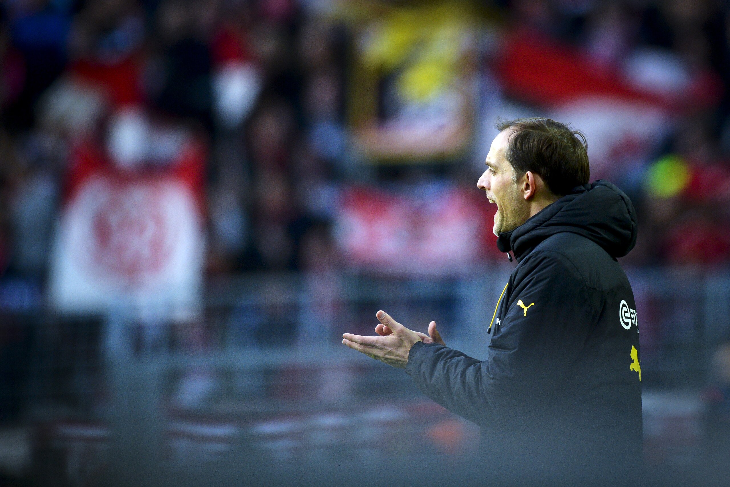 Dordmund's head coach Thomas Tuchel reacts during the German first division Bundesliga football match Borussia Dortmund v 1 FSV Mainz 05 in Dortmund, on March 13, 2016. / AFP / SASCHA SCHUERMANN / RESTRICTIONS: DURING MATCH TIME: DFL RULES TO LIMIT THE ONLINE USAGE TO 15 PICTURES PER MATCH AND FORBID IMAGE SEQUENCES TO SIMULATE VIDEO. == RESTRICTED TO EDITORIAL USE == FOR FURTHER QUERIES PLEASE CONTACT DFL DIRECTLY AT + 49 69 650050
        (Photo credit should read SASCHA SCHUERMANN/AFP/Getty Images)