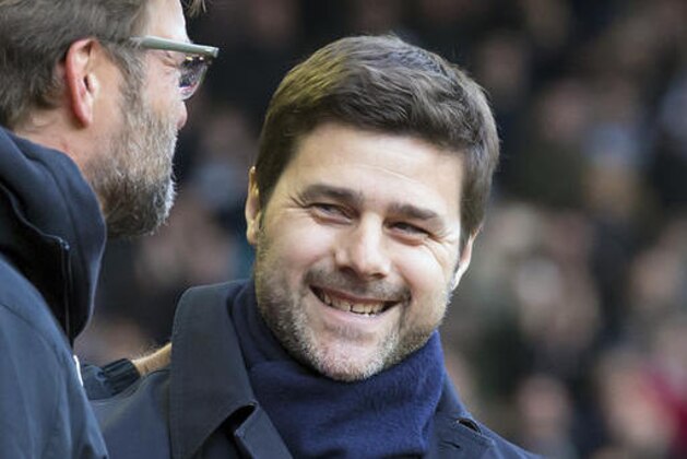 FILE - In this April 2, 2016 file photo, Tottenham's manager Mauricio Pochettino, right, greets Liverpool's manager Juergen Klopp before an English Premier League soccer match in Liverpool, England. Pochettino plans to extend his Tottenham contract until 2021. The Argentine, who arrived at Tottenham on a five-year contract in 2014, announced on Friday, April 29, 2016 he has verbally agreed to a new five-year deal. (AP Photo/Jon Super, File)