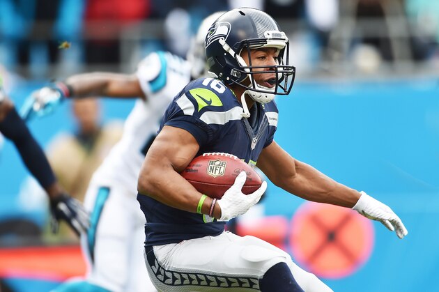 CHARLOTTE, NC - JANUARY 17:  Wide receiver Tyler Lockett #15 of the Seattle Seahawks carries the ball during the NFC Divisional Playoff Game against the Carolina Panthers at Bank of America Stadium on January 17, 2016 in Charlotte, North Carolina.  (Photo by Ronald C. Modra/Sports Imagery/Getty Images)