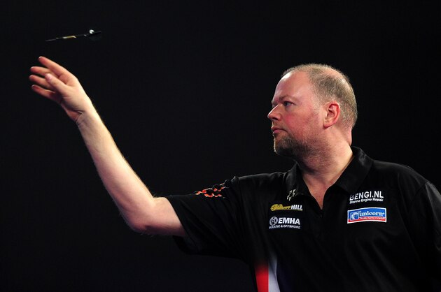 LONDON, ENGLAND - JANUARY 01:  Raymond van Barneveld of the Netherlands throws during his quarter final match against Michael Smith of England during Day Thirteen of the 2016 William Hill PDC World Darts Championships at Alexandra Palace on January 1, 2016 in London, England.  (Photo by Dan Mullan/Getty Images)