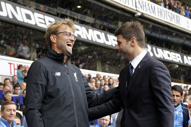 Liverpool's German manager Jurgen Klopp (L) is greeted by Tottenham Hotspur's Argentinian Head Coach Mauricio Pochettino (R) ahead of the English Premier League football match between Tottenham Hotspur and Liverpool at White Hart Lane in north London on October 17, 2015. AFP PHOTO / IAN KINGTON

RESTRICTED TO EDITORIAL USE. No use with unauthorized audio, video, data, fixture lists, club/league logos or 'live' services. Online in-match use limited to 75 images, no video emulation. No use in betting, games or single club/league/player publications.        (Photo credit should read IAN KINGTON/AFP/Getty Images)