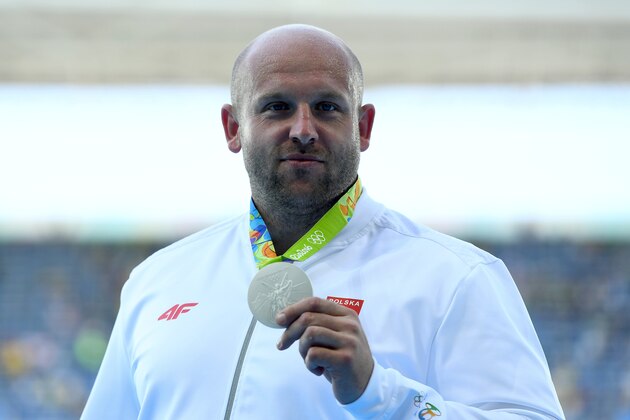 RIO DE JANEIRO, BRAZIL - AUGUST 13:  Silver medalist Piotr Malachowski of Poland celebrates on the podium during the medal ceremony for the Men's Discus Throw Final on Day 8 of the Rio 2016 Olympic Games at the Olympic Stadium on August 13, 2016 in Rio de Janeiro, Brazil.  (Photo by Quinn Rooney/Getty Images)