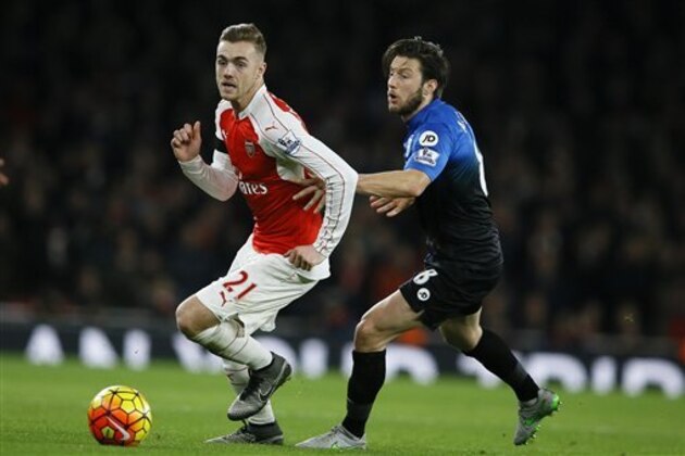 Arsenal's Calum Chambers, left, competes for the ball with Bournemouth's Harry Arter during the English Premier League soccer match between Arsenal and Bournemouth at Emirates stadium in London, Monday, Dec. 28, 2015. (AP Photo/Kirsty Wigglesworth) Arsenal's Calum Chambers, left, competes for the ball with Bournemouth's Harry Arter during the English Premier League soccer match between Arsenal and Bournemouth at Emirates stadium in London, Monday, Dec. 28, 2015. (AP Photo/Kirsty Wigglesworth)