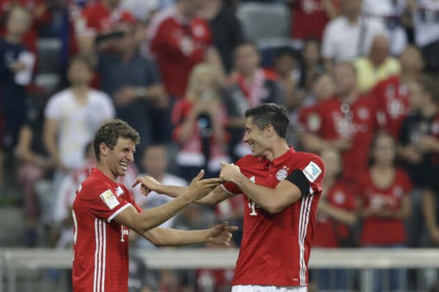 Bayern's Robert Lewandowski, right, celebrates with teammate Thomas Mueller after scoring his side's third goal during the German Bundesliga soccer match between FC Bayern Munich and SV Werder Bremen at the Allianz Arena stadium in Munich, Germany, Friday, Aug. 26, 2016. (AP Photo/Matthias Schrader) Bayern's Robert Lewandowski, right, celebrates with teammate Thomas Mueller after scoring his side's third goal during the German Bundesliga soccer match between FC Bayern Munich and SV Werder Bremen at the Allianz Arena stadium in Munich, Germany, Friday, Aug. 26, 2016. (AP Photo/Matthias Schrader)