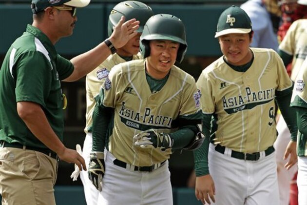 South Korea's Seum Kwon, center, celebrates as he returns to the dugout after hitting a two-run home run off Mexico's Victor Juarez during an International baseball game at the Little League World Series tournament in South Williamsport, Pa., Thursday, Aug. 25, 2016. (AP Photo/Gene J. Puskar)