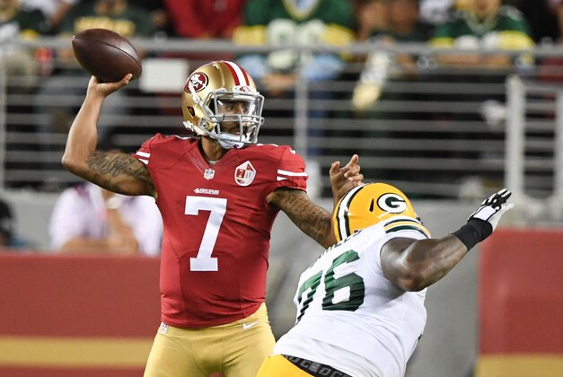 August 26, 2016; Santa Clara, CA, USA; San Francisco 49ers quarterback Colin Kaepernick (7) passes the football against Green Bay Packers defensive end Mike Daniels (76) during the second quarter at Levi's Stadium. Mandatory Credit: Kyle Terada-USA TODAY Sports