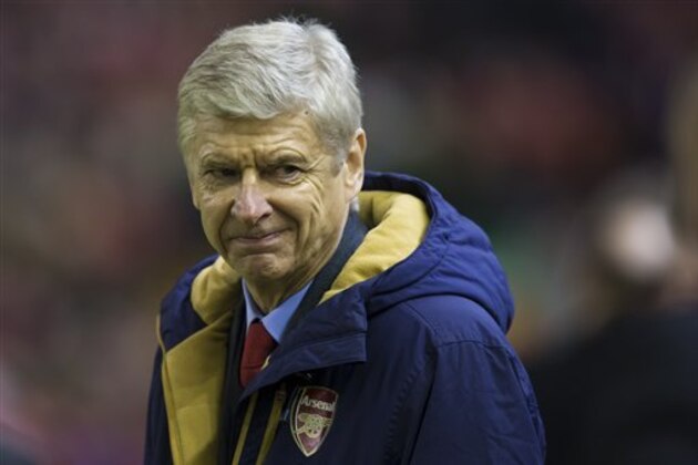 Arsenal's manager Arsene Wenger takes to the touchline before his team's English Premier League soccer match between Liverpool and Arsenal at Anfield Stadium, Liverpool, England, Wednesday, Jan. 13, 2016. (AP Photo/Jon Super)