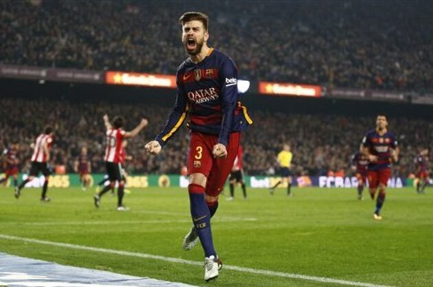 FC Barcelona's Gerard Pique reacts after scoring against Athletic Bilbao during a quarterfinal, second leg, Copa del Rey soccer match at the Camp Nou stadium in Barcelona, Spain, Wednesday, Jan. 27, 2016. (AP Photo/Manu Fernandez)