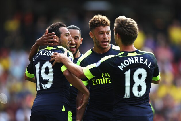 WATFORD, ENGLAND - AUGUST 27: Santi Cazorla of Arsenal celebrates scoring his sides first goal with his team mates during the Premier League match between Watford and Arsenal at Vicarage Road on August 27, 2016 in Watford, England.  (Photo by Christopher Lee/Getty Images)