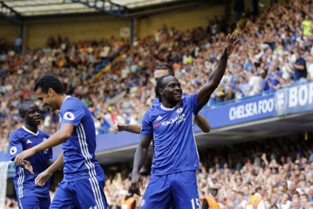 Chelsea's Victor Moses, center, celebrates with teammates after scoring during the English Premier League soccer match between Chelsea and Burnley at Stamford Bridge in London, Saturday, Aug. 27, 2016. (AP Photo/Frank Augstein)