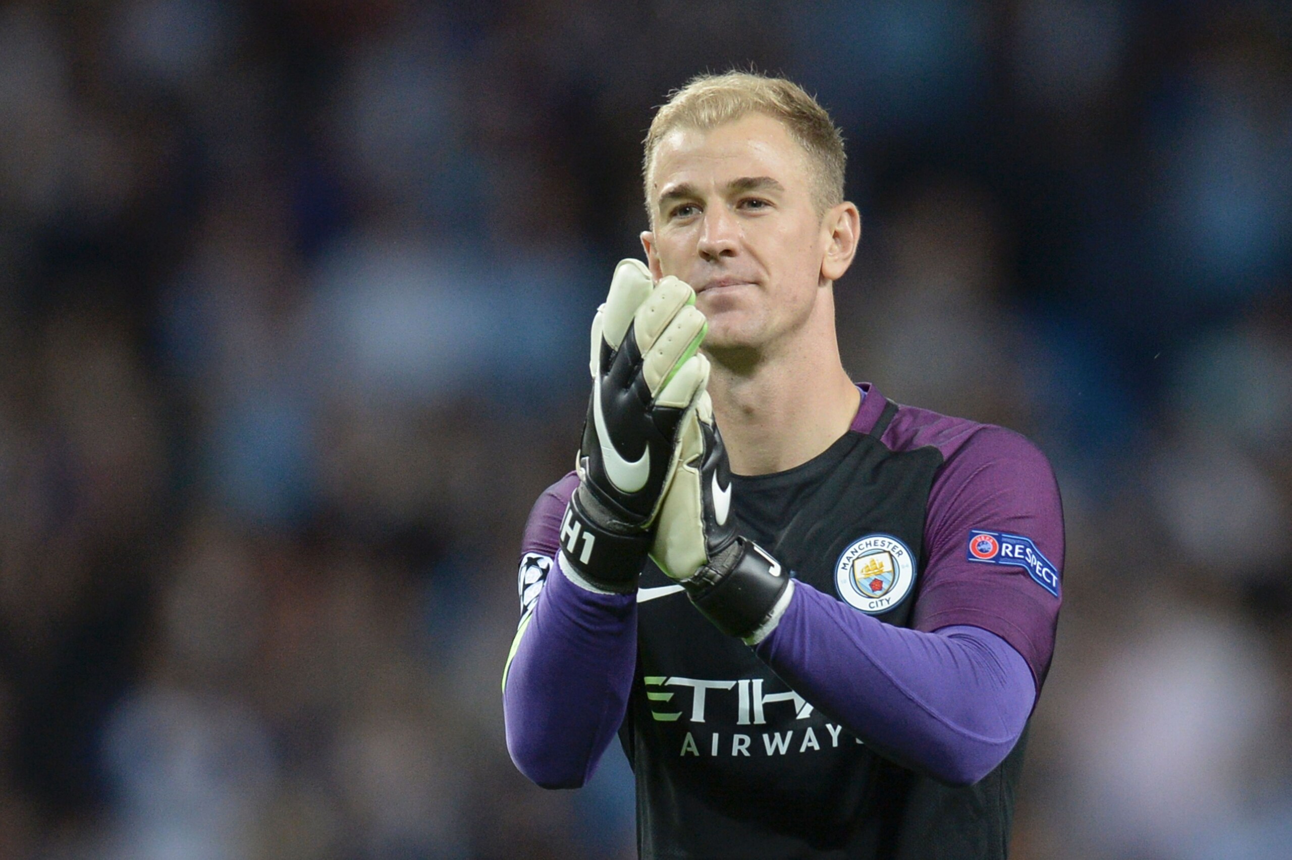 Manchester City's English goalkeeper Joe Hart gestures to the crowd at the end of the UEFA Champions league second leg play-off football match between Manchester City and Steaua Bucharest at the Etihad Stadium in Manchester, north west England on August 24, 2016. / AFP / OLI SCARFF        (Photo credit should read OLI SCARFF/AFP/Getty Images)