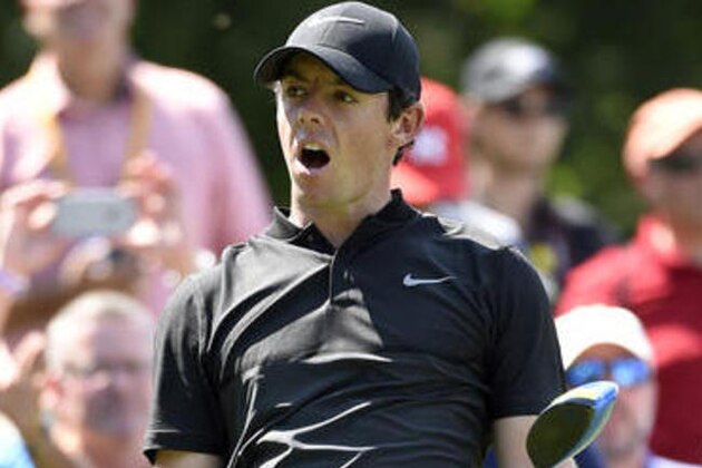 Rory McIlroy, of Northern Ireland, reacts to his tee shot from the 15th hole during the second round of The Barclays golf tournament in Farmingdale, N.Y., Friday, Aug. 26, 2016, (AP Photo/Kathy Kmonicek)