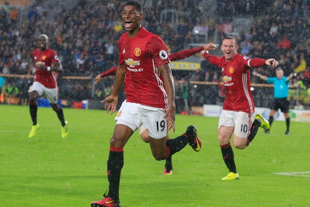 Manchester United's English striker Marcus Rashford celebrates after scoring their late winning goal during the English Premier League football match between Hull City and Manchester United at the KCOM Stadium in Kingston upon Hull, north east England on August 27, 2016.
Manchester united won the game 1-0. / AFP / Lindsey PARNABY / RESTRICTED TO EDITORIAL USE. No use with unauthorized audio, video, data, fixture lists, club/league logos or 'live' services. Online in-match use limited to 75 images, no video emulation. No use in betting, games or single club/league/player publications.  /         (Photo credit should read LINDSEY PARNABY/AFP/Getty Images)
