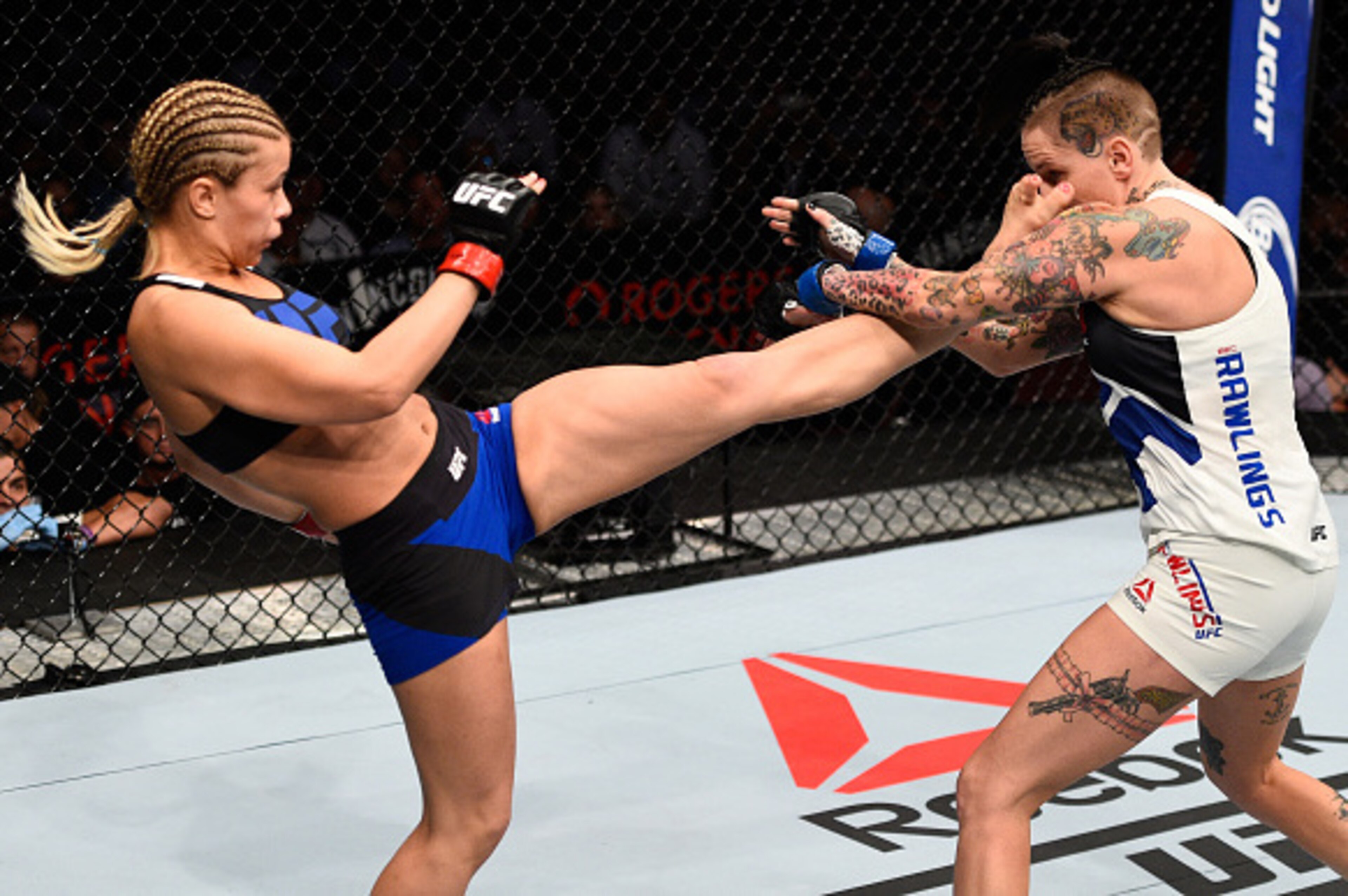 VANCOUVER, BC - AUGUST 27:  (L-R) Paige VanZant of the United States kicks Bec Rawlings of Australia in their women's strawweight bout during the UFC Fight Night event at Rogers Arena on August 27, 2016 in Vancouver, British Columbia, Canada. (Photo by Jeff Bottari/Zuffa LLC/Zuffa LLC via Getty Images)
