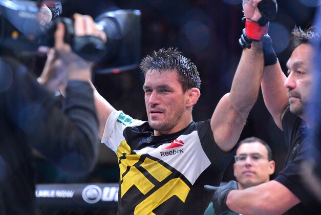 May 14, 2016; Curitiba, Brazil; Demian Maia (red) has his arms raised in victory after defeating Matt Brown (not pictured) during UFC Fight Night at Arena Atletico Paranaense. Mandatory Credit: Jason Silva-USA TODAY Sports