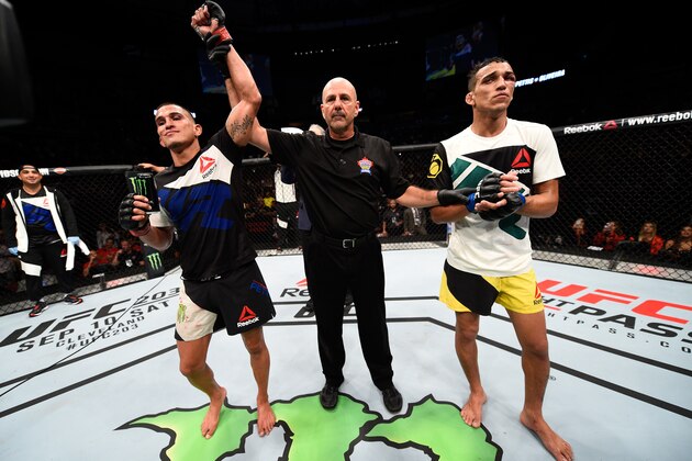 VANCOUVER, BC - AUGUST 27:  (L-R) Anthony Pettis of the United States celebrates his submission victory over Charles Oliveira of Brazil in their featherweight bout during the UFC Fight Night event at Rogers Arena on August 27, 2016 in Vancouver, British Columbia, Canada. (Photo by Jeff Bottari/Zuffa LLC/Zuffa LLC via Getty Images)