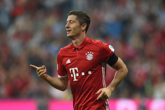 Bayern Munich's Polish striker Robert Lewandowski celebrate after his second goal during the German first division Bundesliga football match between FC Bayern Munich vs SV Werder Bremen in Munich, southern Germany, on August 26, 2016.  / AFP / CHRISTOF STACHE / RESTRICTIONS: DURING MATCH TIME: DFL RULES TO LIMIT THE ONLINE USAGE TO 15 PICTURES PER MATCH AND FORBID IMAGE SEQUENCES TO SIMULATE VIDEO. == RESTRICTED TO EDITORIAL USE == FOR FURTHER QUERIES PLEASE CONTACT DFL DIRECTLY AT + 49 69 650050
        (Photo credit should read CHRISTOF STACHE/AFP/Getty Images)