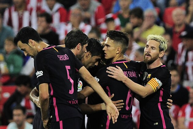 Barcelona's players celebrate after scoring the opener during the Spanish league football match Athletic Club Bilbao vs FC Barcelona at the San Mames stadium in Bilbao on August 28, 2016. / AFP / ANDER GILLENEA        (Photo credit should read ANDER GILLENEA/AFP/Getty Images)
