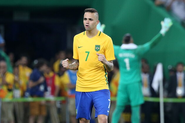 RIO DE JANEIRO, BRAZIL - AUGUST 20: Luan of Brazil celebrates scoring his penalty during the penalty shootout of the Men's Soccer Final between Brazil and Germany on day 15 of the Rio 2016 Olympic Games at Maracana Stadium on August 20, 2016 in Rio de Janeiro, Brazil. (Photo by Jean Catuffe/Getty Images)