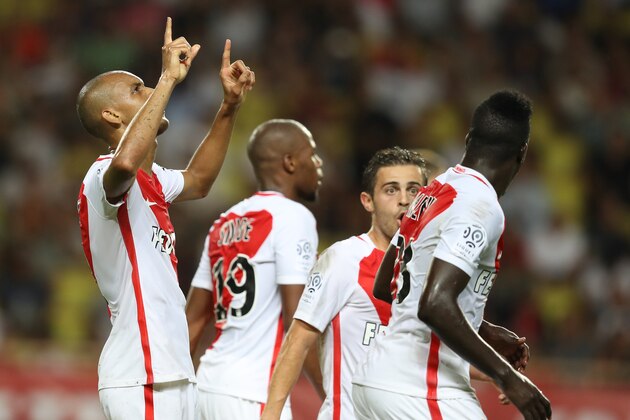 Monaco's Brazilian defender Fabinho (L) celebrates with teammates after scoring a goal during the French Ligue 1 football match Monaco (ASM) versus Paris-Saint-Germain (PSG) on August 28, 2016 at the Louis II Stadium in Monaco.   / AFP / VALERY HACHE        (Photo credit should read VALERY HACHE/AFP/Getty Images)