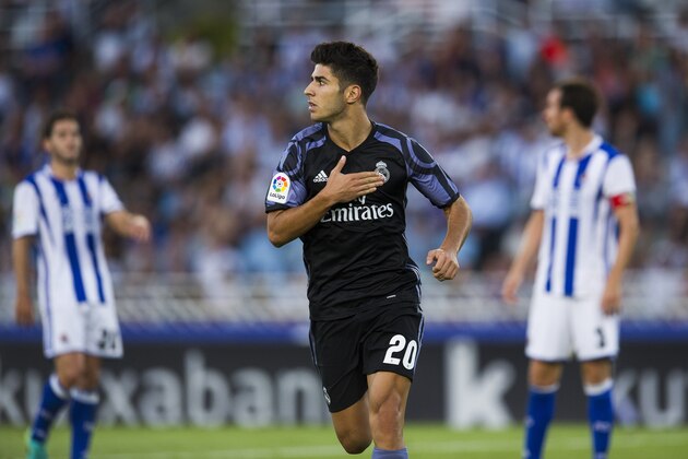 SAN SEBASTIAN, SPAIN - AUGUST 21:  Marco Asensio of Real Madrid celebrates after scoring his team's second goal during the La Liga match between Real Sociedad de Futbol and Real Madrid at Estadio Anoeta on August 21, 2016 in San Sebastian, Spain.  (Photo by Juan Manuel Serrano Arce/Getty Images)