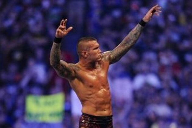 FILE- In this Sunday, April 3, 2011 file photo, WWE Superstar Randy Orton celebrates defeating CM Punk (not pictured) during WrestleMania XXVII at the Georgia Dome in Atlanta, Georgia on. World-famous WWE wrestlers such as John Cena, Shaemus and champion Randy Orton are in Saudi Arabia for three days of matches in the capital Riyadh. (Paul Abell/AP Images for WWE, File)