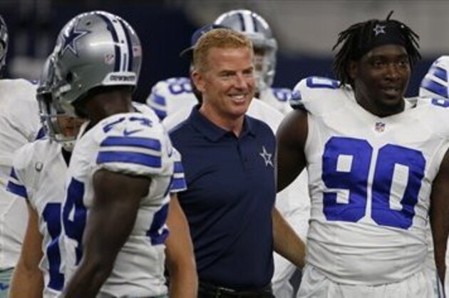 Dallas Cowboys head coach Jason Garrett stands with players including defensive end Demarcus Lawrence (90) and  defensive end Mike McAdoo (66) before a preseason NFL football game against the Miami Dolphins Friday, Aug. 19, 2016, in Arlington, Texas. (AP Photo/Ron Jenkins)