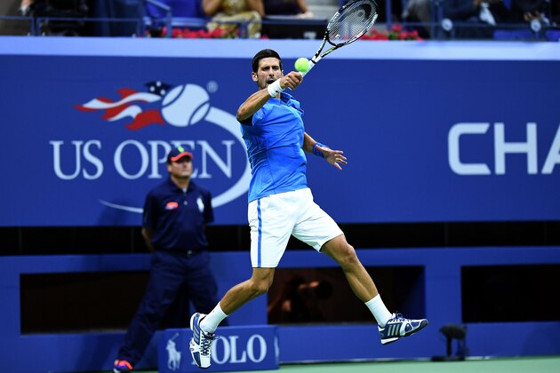 Novak Djokovic of Serbia hits a return against Jerzy Janowicz of Poland during their 2016 US Open Men's Singles match at the USTA Billie Jean King National Tennis Center in New York on August 29, 2016. / AFP / Jewel SAMAD        (Photo credit should read JEWEL SAMAD/AFP/Getty Images)